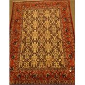 Persian red and beige ground rug, decorated with Herati and Boteh motifs, 310cm x 215cm