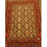 Persian red and beige ground rug, decorated with Herati and Boteh motifs, 310cm x 215cm