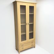 G-Plan oak display cabinet, two glazed doors enclosing two shelves above two drawers, stile supports
