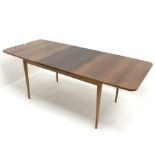 Mid century extending dining table, on teak base, turned tapering supports, W145cm, H72cm D87cm