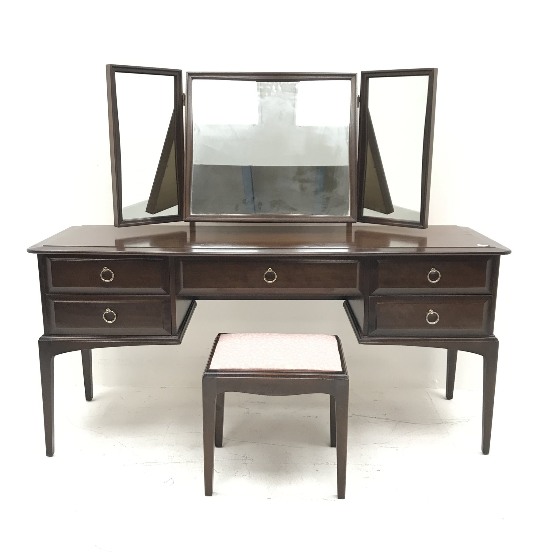 Stag mahogany dressing table, raised three piece mirror back, five drawers, square tapering supports