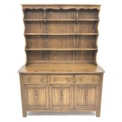 Ercol Old Colonial elm dresser, Golden Dawn finish, raised three tier plate rack above three drawers