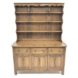 Ercol Old Colonial elm dresser, Golden Dawn finish, raised three tier plate rack above three drawers