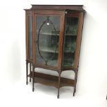 Edwardian inlaid mahogany display cabinet, raised shaped back, concaved corners flanking single gla