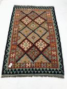 Choli Kilim blue ground rug, geometric patterned field, 158cm x 100cm