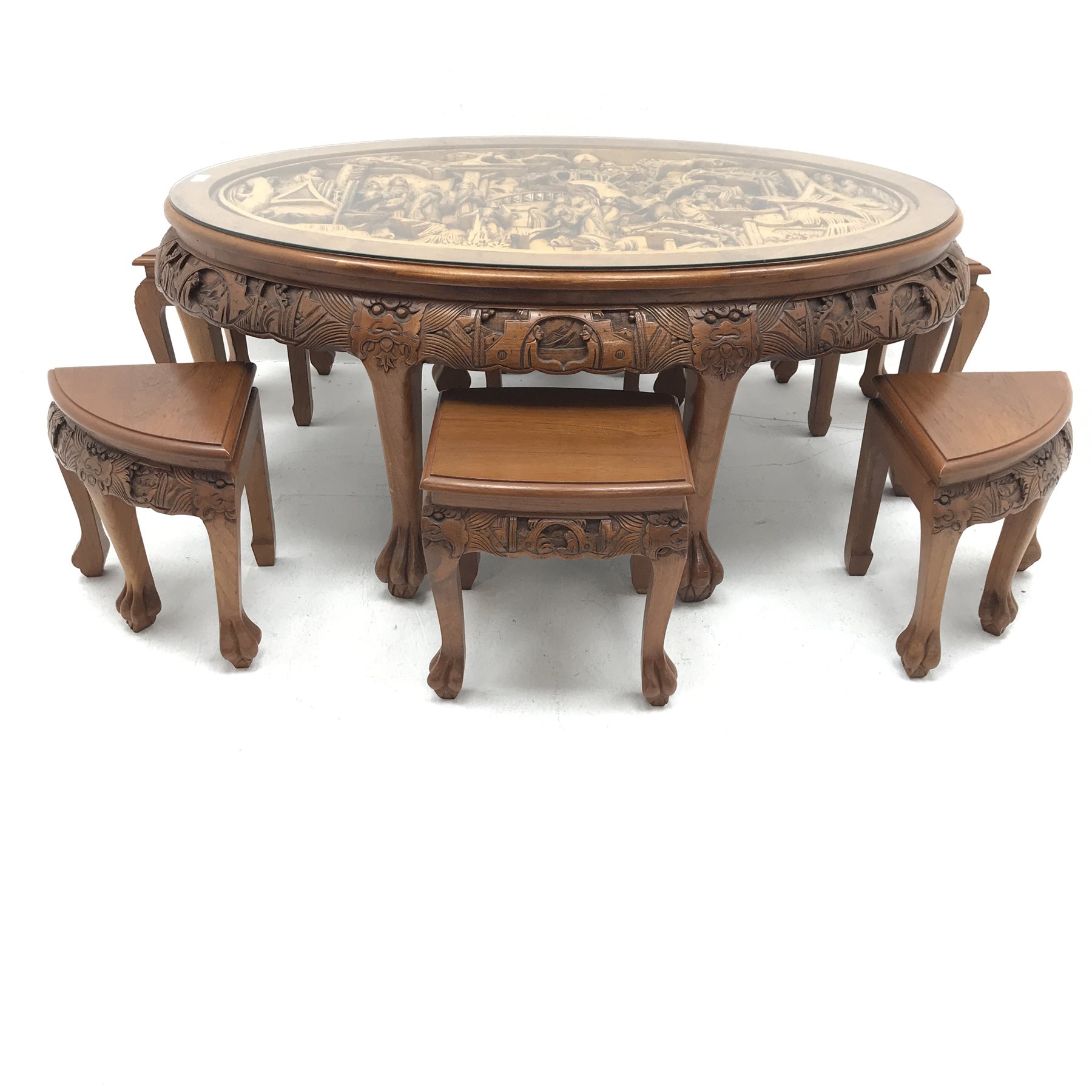 Eastern glass topped oval table decorated in high relief with six integral stools, W124cm, H50cm, D8 - Image 3 of 5