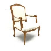 French style beech framed armchair, carved and shaped cresting rail, upholstered back, seat and arms