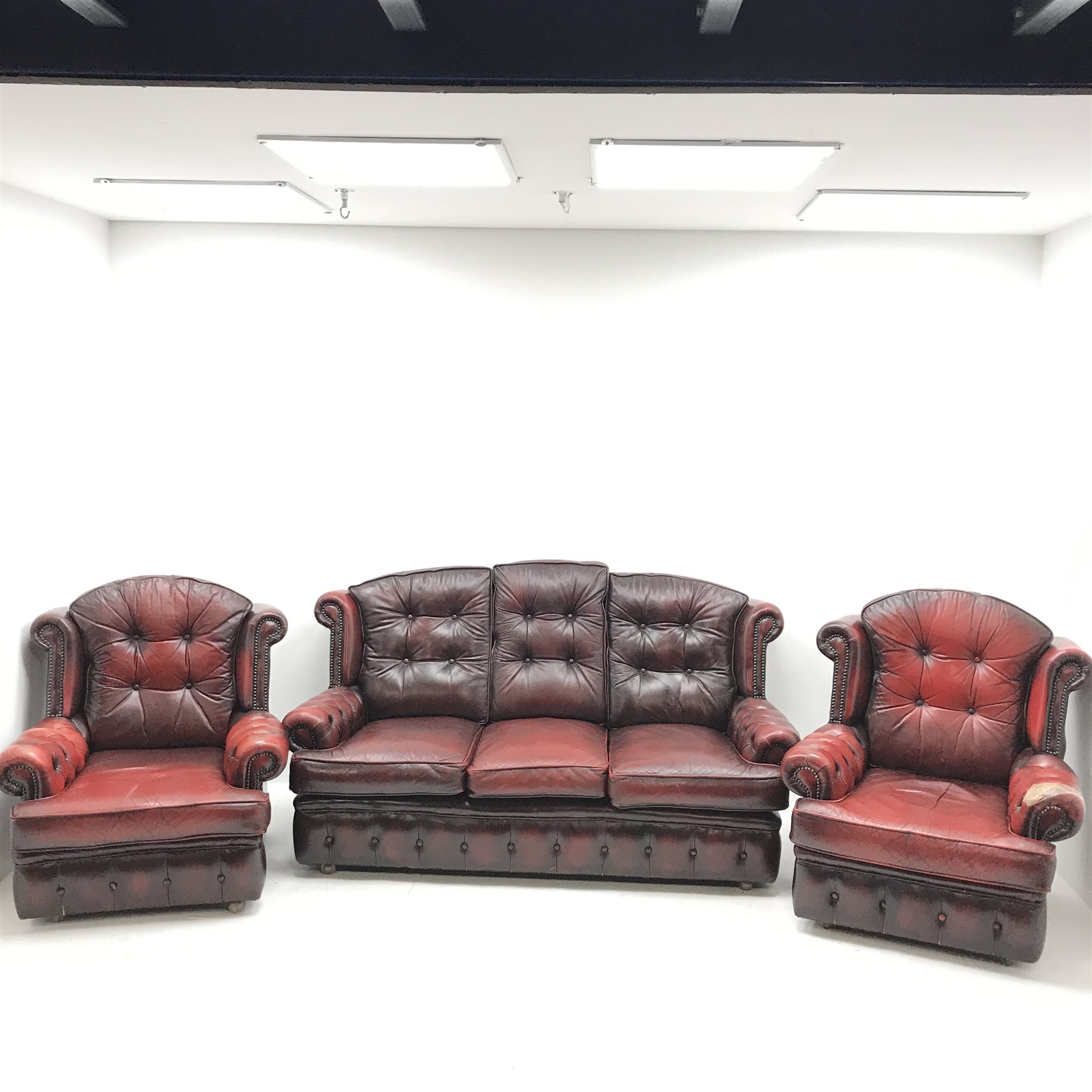 Georgian style three seat sofa upholstered in deep buttoned vintage red leather (W175cm) and pair of