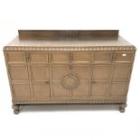 E. Gomme Ltd of High Wycombe oak sideboard, raised carved back, moulded top, three drawers above two