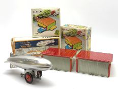 Three modern tin-plate toys comprising Schylling Aluminium Airship L24cm; and two Kovap garages with