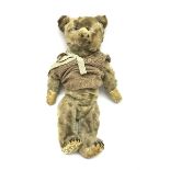 Early 20th century plush covered straw filled teddy bear, the revolving head with boot button eyes a