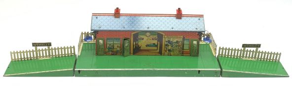 Hornby '0' gauge - three-piece Wembley Station fitted with electric lighting, tin printed building a