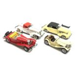 Four Franklin Mint die-cast model cars comprising 1935 Auburn 851 Speedster, 1937 Cord 812, 1935 Mer