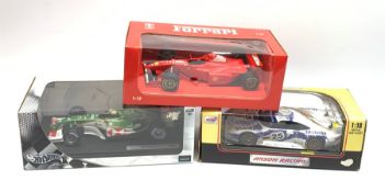 Three 1:18 scale die-cast racing cars comprising Paul's Model Art Ferrari F 310B 1997 M. Schumacher,
