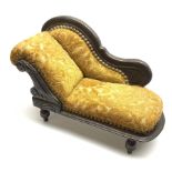 Late 19th/early 20th century doll's chaise longue with mahogany stained carved frame, scrolling back