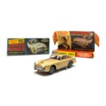 Corgi - James Bond Aston Martin D.B.5 No.261, boxed with inner pictorial stand and one bandit figure