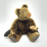 Mid-20th century plush covered teddy bear, the revolving head with applied eyes and stitched nose an