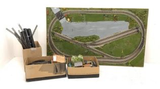 '00' gauge model railway layout of oblong form on six removable tubular legs, the outer loop enclosi