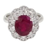 18ct white gold oval ruby and round brilliant cut diamond cluster ring, stamped 750, ruby 3.94 carat
