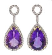 Pair of 18ct gold pear shaped amethyst pendant earrings, with diamond surround, amethyst total weigh