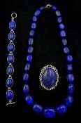 Lapis necklace, oval link bracelet and brooch