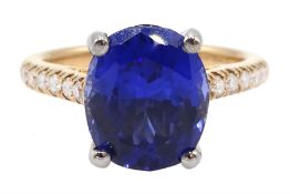 Platinum and 18ct rose gold oval synthetic sapphire ring, with diamond set shoulders, hallmarked and