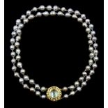 Double strand Tahitian pearl necklace, seventy-two cultured pearls, on a gold cabochon blue topaz an