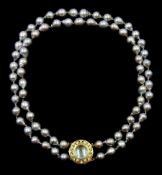 Double strand Tahitian pearl necklace, seventy-two cultured pearls, on a gold cabochon blue topaz an