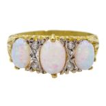 Silver-gilt three stone opal and cubic zirconia ring, stamped Sil