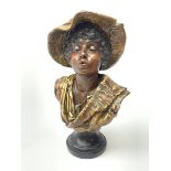 19th century plaster bust of a young boy wearing a hat on black painted socle base, H49cm