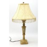 An antique style composite cream table lamp, with cream beaded shade, overall H67.5cm.