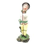 A 19th century H�chst porcelain figure, modelled as a young boy holding a Garland of flowers, H14cm,