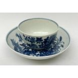 An 18th century Worcester porcelain half size tea bowl and saucer, each transfer print decorated in