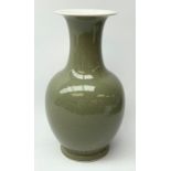 A celadon glaze vase, of baluster form with tall neck and flared rim, with foliate decoration, paint