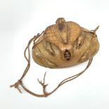 A lady's shoulder bag of rugby ball shape formed from a lined armadillo skin with head and limbs, en