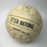 Leather football signed by various Leeds United players from the 1970s including Joe Jordan, Norman