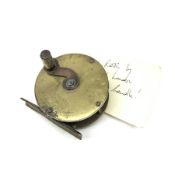 T. Aldred brass reel with silver mounted handle, D2.75"