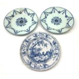 Pair of 18th Century English Delft blue and white plates decorated with a central floral roundel enc