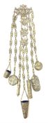 A Victorian metal chatelaine, the scrolling pierced and mask and putti decorated clip suspending sev