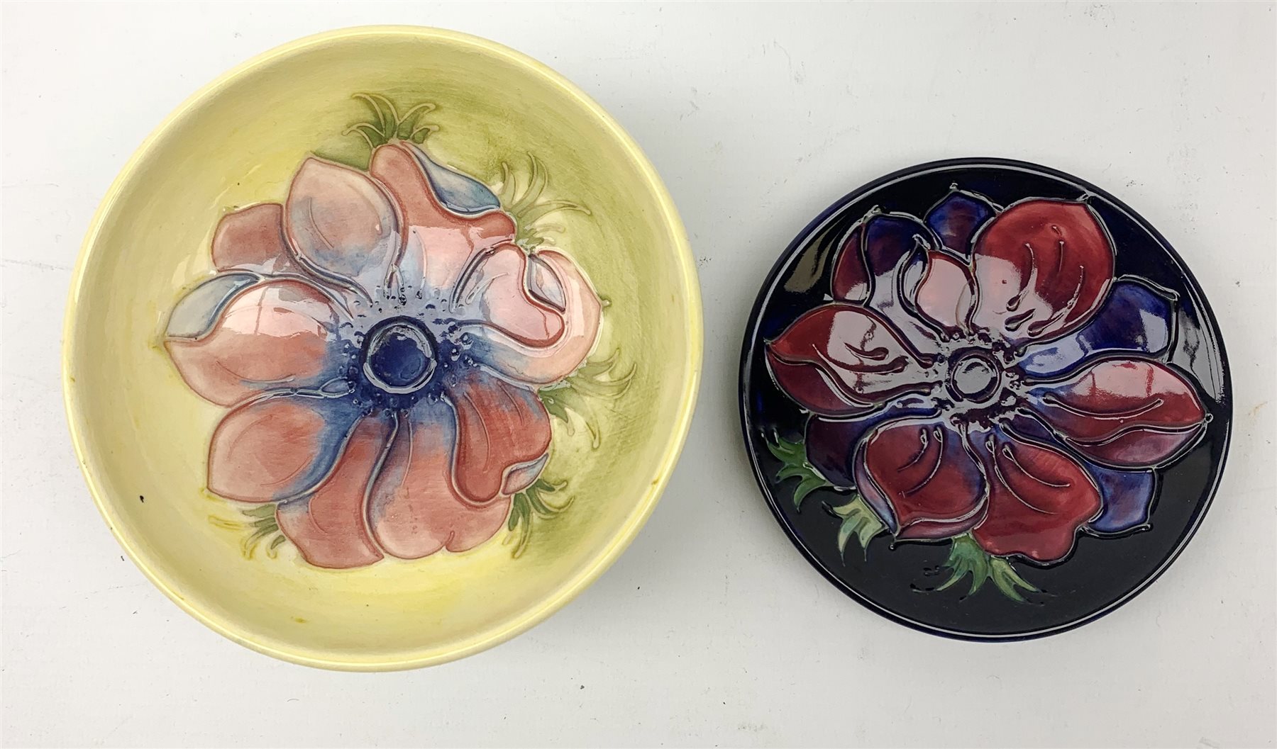 A Moorcroft dish, decorated with the Clematis pattern upon a yellow ground, with paper label beneath - Image 2 of 3