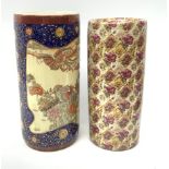 Two ceramic stick stands, the first Oriental example detailed with phoenix and flowers within a blue