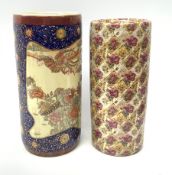 Two ceramic stick stands, the first Oriental example detailed with phoenix and flowers within a blue