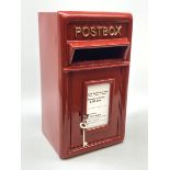 A reproduction red painted cast iron Postbox, H43.5cm, W24cm, D23cm.
