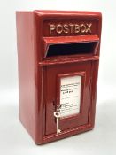 A reproduction red painted cast iron Postbox, H43.5cm, W24cm, D23cm.