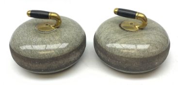 Pair of early 20th century Curling Stones, the bronze handles with ebonised grips, D30cm