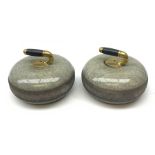 Pair of early 20th century Curling Stones, the bronze handles with ebonised grips, D30cm