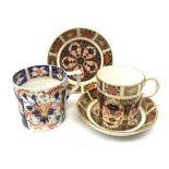 An early 19th century Crown Derby coffee can, together with three pieces of Crown Derby Imari 1128 p