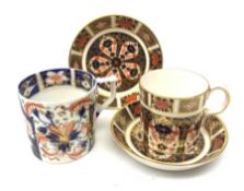 An early 19th century Crown Derby coffee can, together with three pieces of Crown Derby Imari 1128 p