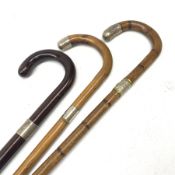 Three silver mounted walking canes, the first hallmarked Kendall & Sons Ltd, London, date letter wor