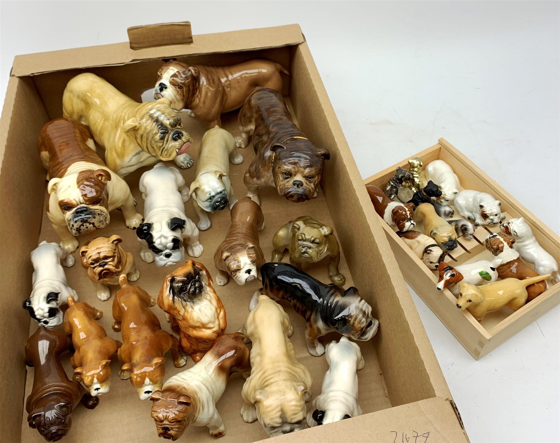 A large collection of mainly Bulldog and other dog figurines, to include a number of examples by Bes